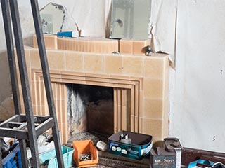 fireplace and junk in abandoned house