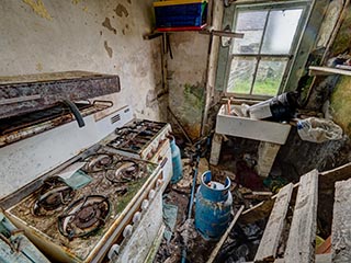 filthy kitchen in abandoned house