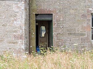 open front door of abandoned house