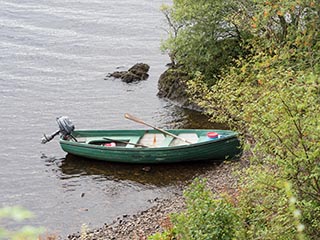 boat moored on stony beach