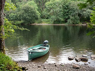 boat moored on stony beach