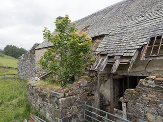 partially collapsed roof and wall