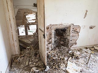 damaged wall in abandoned house